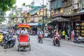 View of busy traffic with many motorbikes and vehicles in Hanoi Old Quarter, capital of Vietnam. Royalty Free Stock Photo