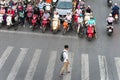 Hanoi, Vietnam - Oct 11, 2016: Aerial view of traffic on Dai La street at rush hour, with a boy crossing street Royalty Free Stock Photo