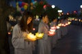 Hanoi, Vietnam - Oct 10, 2014: Buddhists hold flower garlands and colored lanterns for celebrating Buddha`s birthday organised at Royalty Free Stock Photo