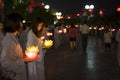 Hanoi, Vietnam - Oct 10, 2014: Buddhists hold flower garlands and colored lanterns for celebrating Buddha`s birthday organised at Royalty Free Stock Photo