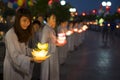 Hanoi, Vietnam - Oct 10, 2014: Buddhists hold flower garlands and colored lanterns for celebrating Buddha`s birthday organised at Royalty Free Stock Photo