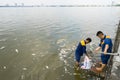 Hanoi, Vietnam - Oct 2, 2016: Garbage collector, environment workers take mass dead fishes out from West Lake Royalty Free Stock Photo