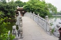 Very beautiful traditional bridge to the temple on the lake