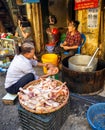 Local vendors selling food at Old Quarter morning market in Hanoi Royalty Free Stock Photo