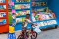 Hanoi, Vietnam - Sep 2, 2016: A boy with bicycle looking at book stall on Le Thach street