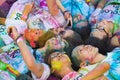 Hanoi, Vietnam - Sep 23, 2015: Group of teenagers taking photo at public color run event in Hanoi capital city. Hundreds of people