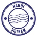 HANOI - VIETNAM, words written on blue postal stamp Royalty Free Stock Photo