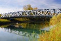 Hans Wilsdorf Bridge or Birds`s nest bridge over the Arve River in Geneva. Royalty Free Stock Photo