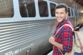 Hansdome commuter smiling while waiting for his train Royalty Free Stock Photo