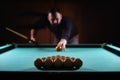 Hansome man playing billiards alone Royalty Free Stock Photo