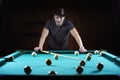 Hansome man playing billiards alone Royalty Free Stock Photo