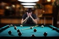 Hansome man playing billiards alone Royalty Free Stock Photo