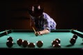 Hansome man playing billiards alone Royalty Free Stock Photo