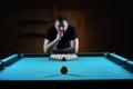 Hansome man playing billiards alone Royalty Free Stock Photo