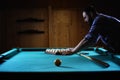 Hansome man playing billiards alone Royalty Free Stock Photo