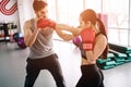 Hansome and well-built partners are boxing together. She attackes hi, while he is trying to defennce himself and also
