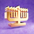 Hanukiah icon. Gold glossy Hanukiah symbol isolated on violet velvet background.