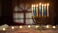 Hanukkah candlestick with book on table Royalty Free Stock Photo