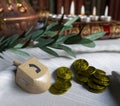 Hanukkah close up with candles,spinning top and gold antique coins Royalty Free Stock Photo