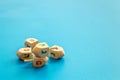 Hanukkah dreidels on blue table. Jewish holideys concept. Close up, space for text Royalty Free Stock Photo