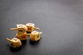 Hanukkah dreidels on gray table. Jewish holideys concept. Close up, space for text Royalty Free Stock Photo