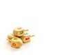 Hanukkah dreidels on white table. Jewish holideys concept. Close up, space for text Royalty Free Stock Photo