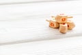 Hanukkah dreidels on wooden table. Jewish holideys concept. Close up, space for text