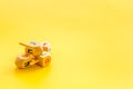 Hanukkah dreidels on yellow table. Jewish holideys concept. Close up, space for text Royalty Free Stock Photo