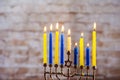Hanukkah festivity lighting menorah candles in jewish hanukkiah