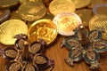 Hanukkah gelt chocolate coins with star of David on back and silver dreidel with pomegranate