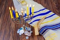 Hanukkah holiday menorah on wooden table over window background Royalty Free Stock Photo