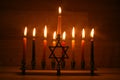 Hanukkah is a Jewish holiday. Burning Chanukah candlestick with candles. Chanukiah Menorah