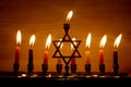 Hanukkah is a Jewish holiday. Burning Chanukah candlestick with candles. Chanukiah Menorah