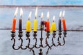 Hanukkah menorah with candles and silver dreidel. Royalty Free Stock Photo