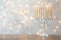 Hanukkah menorah with candles on table Royalty Free Stock Photo