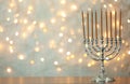 Hanukkah menorah with candles on table Royalty Free Stock Photo