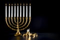Hanukkah menorah with dreidel and chocolate coins Royalty Free Stock Photo