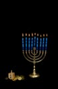 Hanukkah Menorah with a Dreidel and Gelt Royalty Free Stock Photo
