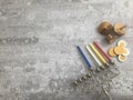 Hanukkah menorah dridles and coins on a gray surface