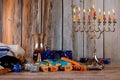 jewish holiday Hanukkah with menorah traditional Candelabra and wooden dreidels spinning Royalty Free Stock Photo