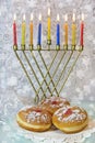 Hanukkah menorah and traditional doughnuts Royalty Free Stock Photo