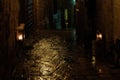 Hanukkah menorahs glow on a rainy winter night in the Old City of Jerusalem Royalty Free Stock Photo
