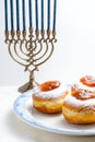 Hanukkah Minor, donuts with jam on a plate close-up Royalty Free Stock Photo