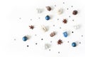 Hanukkah styled stock composition. Decorative pattern. Wooden dreidel toys, larch cones, anise and silver confetti stars