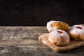 Hanukkah sufganiyot on black slate