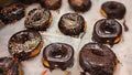 Hanukkah symbols: doughnut Sufganiyah or Sufganiyot with chocolate glaze