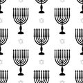 Hanukkah symbols menorah with candles star of david seamless pattern. Black silhouette background for Jewish festival of Royalty Free Stock Photo