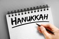 Hanukkah text on notepad, holiday concept background