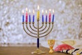 Hanukkiah Menorah candle light during a traditional celebration of Jewish religion holiday