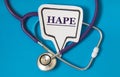 HAPE - acronym on white figure sheet on a blue background with a stethoscope